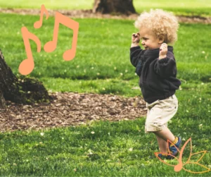 Outdoor music classes toddler dancing on grass