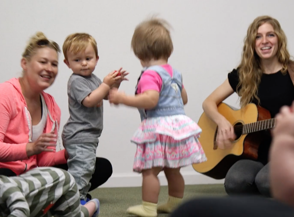 Kids playing in group music class. 